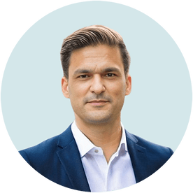 A man in a blue suit and white shirt